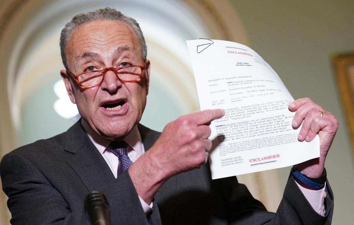 Senate Minority  Leader Charles E. Schumer (D-N.Y.) holds the rough transcript of the July phone call between President Trump and Ukrainian President Volodymyr Zelensky on Sept. 25, 2019. 