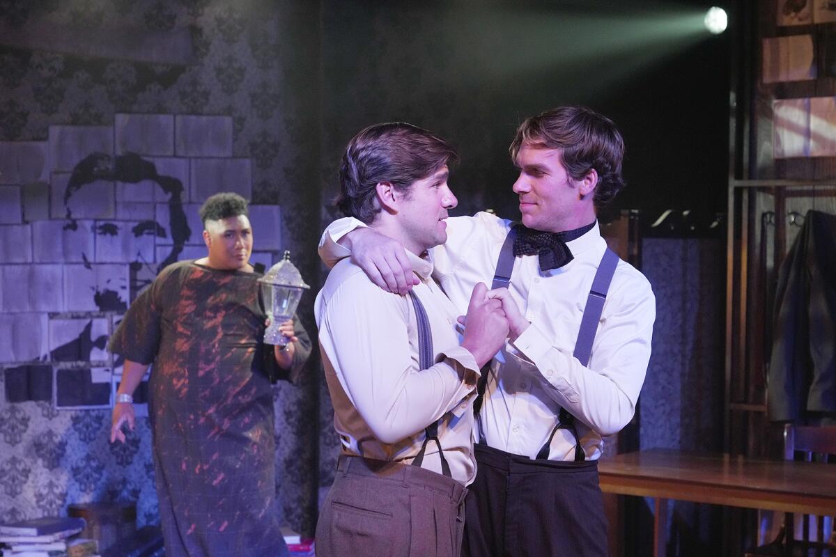 Two figures embrace while a third person looks on from a distance.