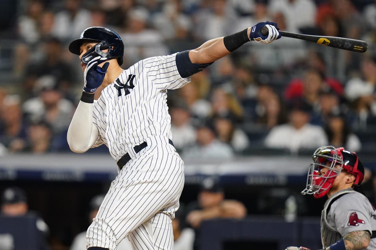 New York Yankees' Aaron Judge follows through on a home run during the fifth inning of the team's baseball game against the Boston Red Sox on Saturday, July 16, 2022, in New York. (AP Photo/Frank Franklin II)