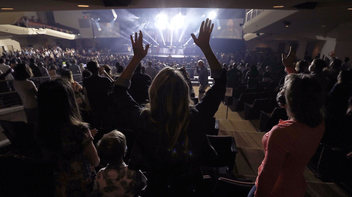 After more than a year without indoor services, Rock Church in Point Loma invited worshippers inside on April 18.