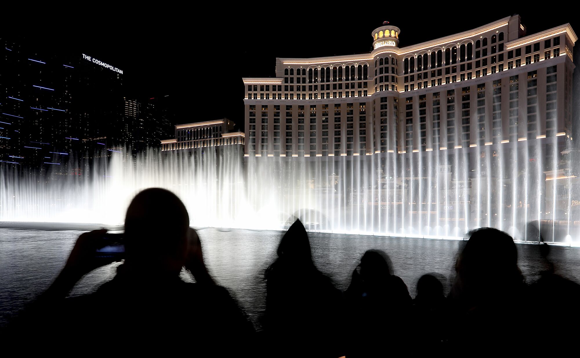 Visitors take in the free water show at the Bellagio Hotel and Casino on the Las Vegas Strip. 