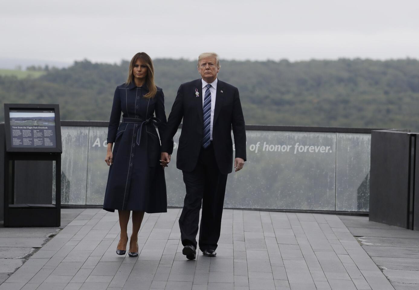 President Donald Trump and first lady Melania Trump, walk along the September 11th Flight 93 memorial Sept. 11, 2018, in Shanksville, Pa.