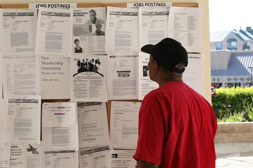Job seeker Melaku Woldeamanuel browses job listings at the Rubicon Programs One Stop Career Center in San Francisco on April 3.