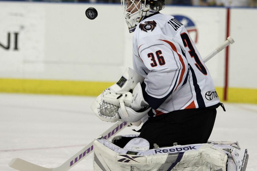 Goalie Jeff Zatkoff blocks a shot with his shoulder pad while playing for the Ontario Reign, a Kings minor league affiliate, on April 21, 2009.