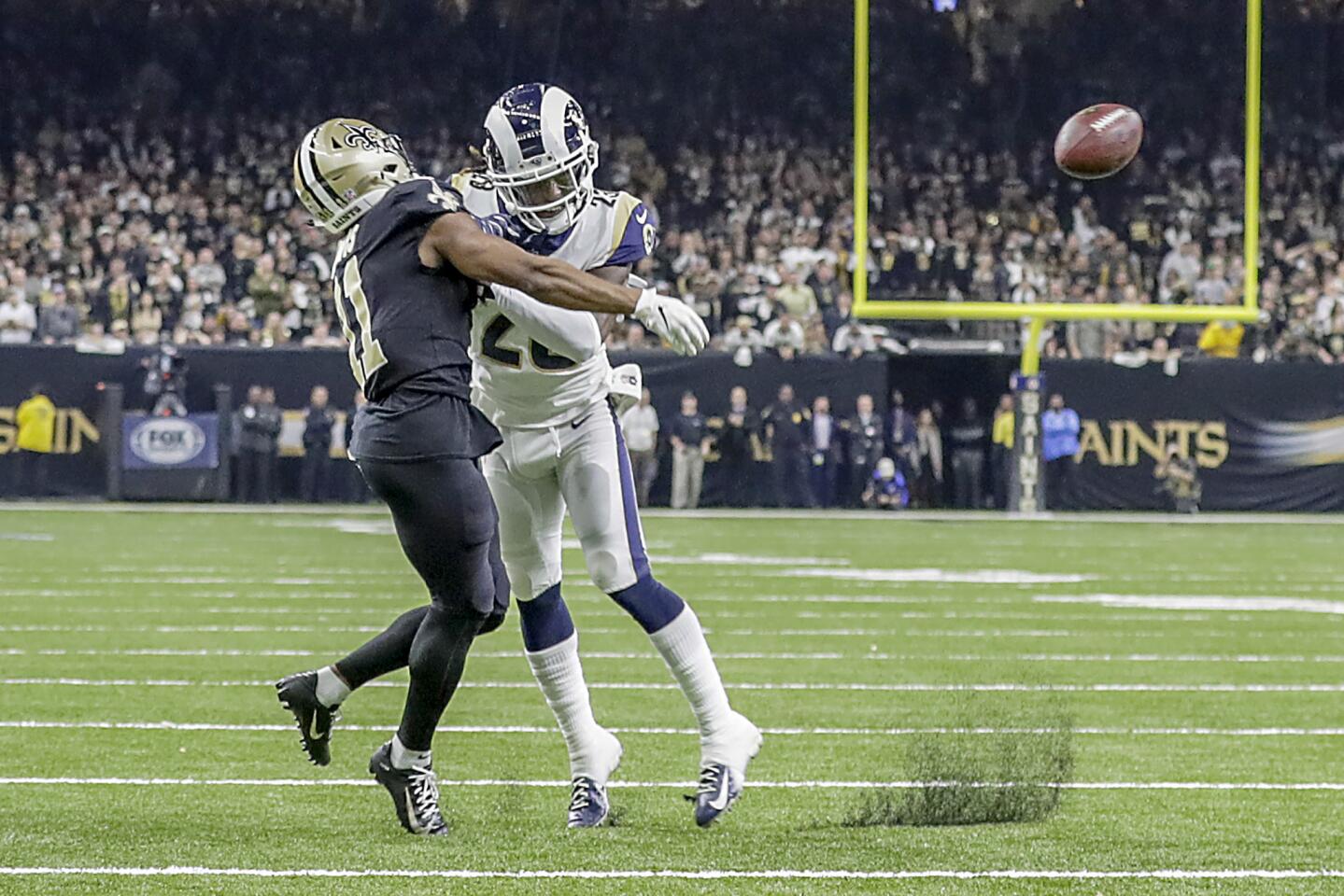 Rams cornerback Nickell Robey-Coleman seems to deliver an early hit to New Orleans Saints rexeiver Tommylee Lewis late in the fourth quarter, thwarting a potential game-winning drive in the NFC Championship at the Superdome.