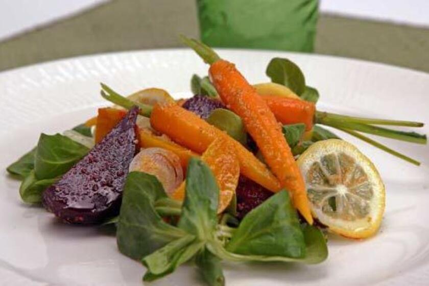 TASTE OF MOROCCO: Canelés roasted red and gold beet salad has baby carrots, mâche and thin slices of lemon.