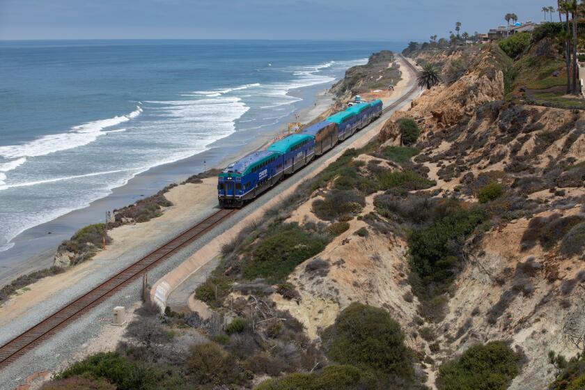 Del Mar, CA - June 25: The Coaster train rides along the beach in Del Mar on Friday, June 25, 2021 in Del Mar, CA. (Jarrod Valliere / The San Diego Union-Tribune)