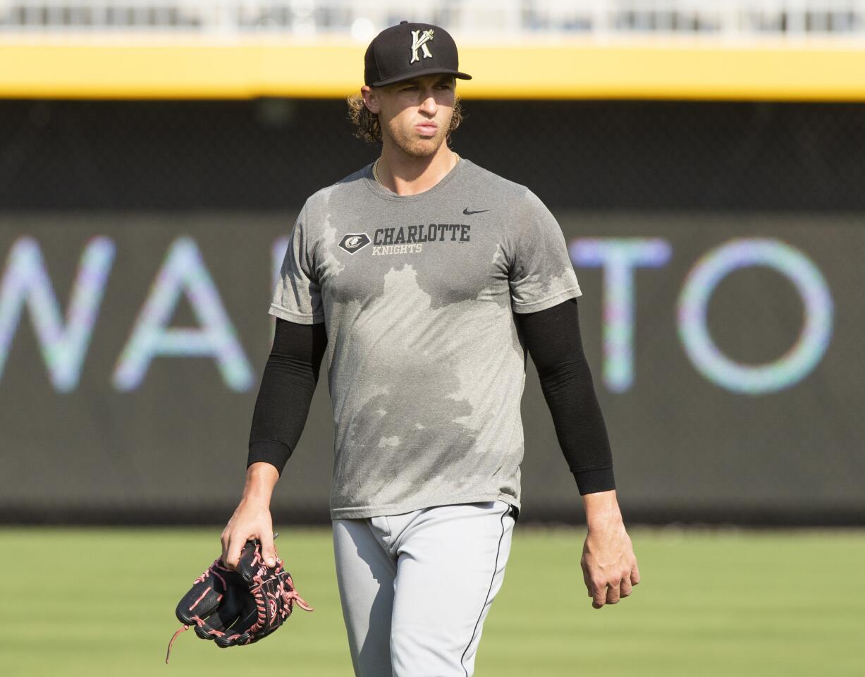Charlotte Knights pitcher Michael Kopech warms up before a minor-league baseball game against the Durham Bulls at Durham Bulls Athletic Park in Durham, N.C., on Thursday, July 12, 2018.