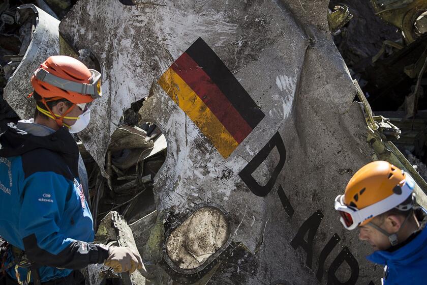 Gendarmes and rescuers from the Gendarmerie High-Mountain Rescue Group working at the crash site of the Germanwings Airbus A320 on March 31, 2015. The co-pilot who is believed to have deliberately crashed a Germanwings jet in the French Alps may have "rehearsed" steering the plane into a rapid descent on an earlier flight, German daily Bild reported on May 6, 2015.