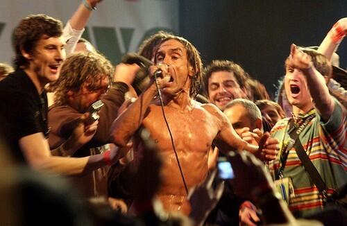 Iggy Pop performs in the crowd during his set with the Stooges at the South by Southwest Music Festival in Austin, Texas.