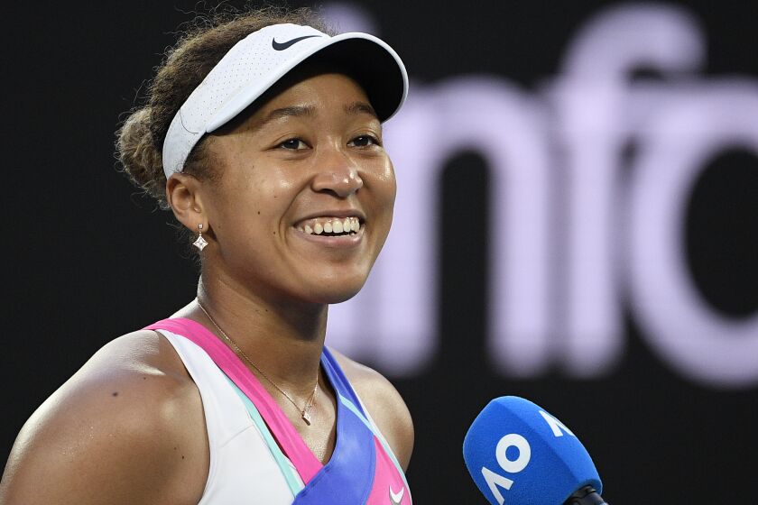 FILE - Naomi Osaka of Japan appears at the Australian Open tennis championships in Melbourne, Australia, on Jan. 19, 2022. The tennis star has a deal with HarperCollins Publishers for a children’s picture book, “The Way Champs Play,” scheduled to come out Dec. 6. (AP Photo/Andy Brownbill, File)