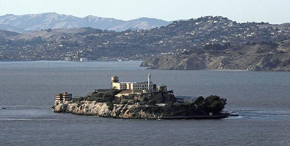 A small boat sank Sunday near Alcatraz island in the San Francisco Bay, forcing the rescue of three people onboard.