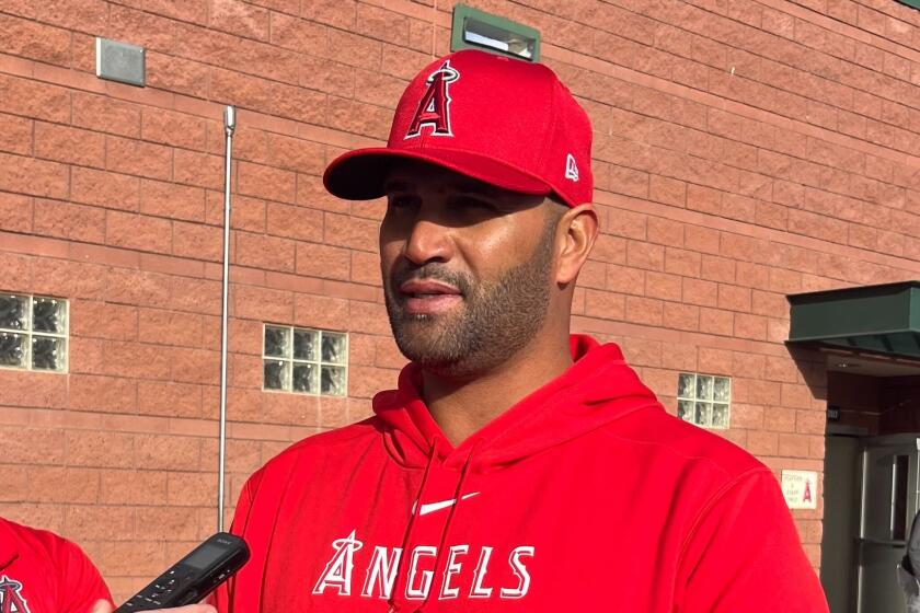 Albert Pujols speaks with reporters at Angels camp on Monday, March 4, 2024, in Tempe, Ariz.
