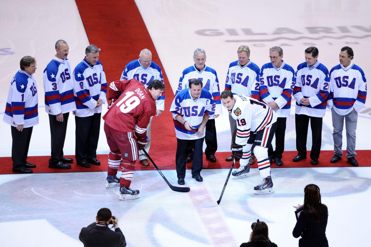 Mike Eruzione drops the puck before a game between the Coyotes and the Blackhawks on Feb. 7, 2014 at Gila River Arena.