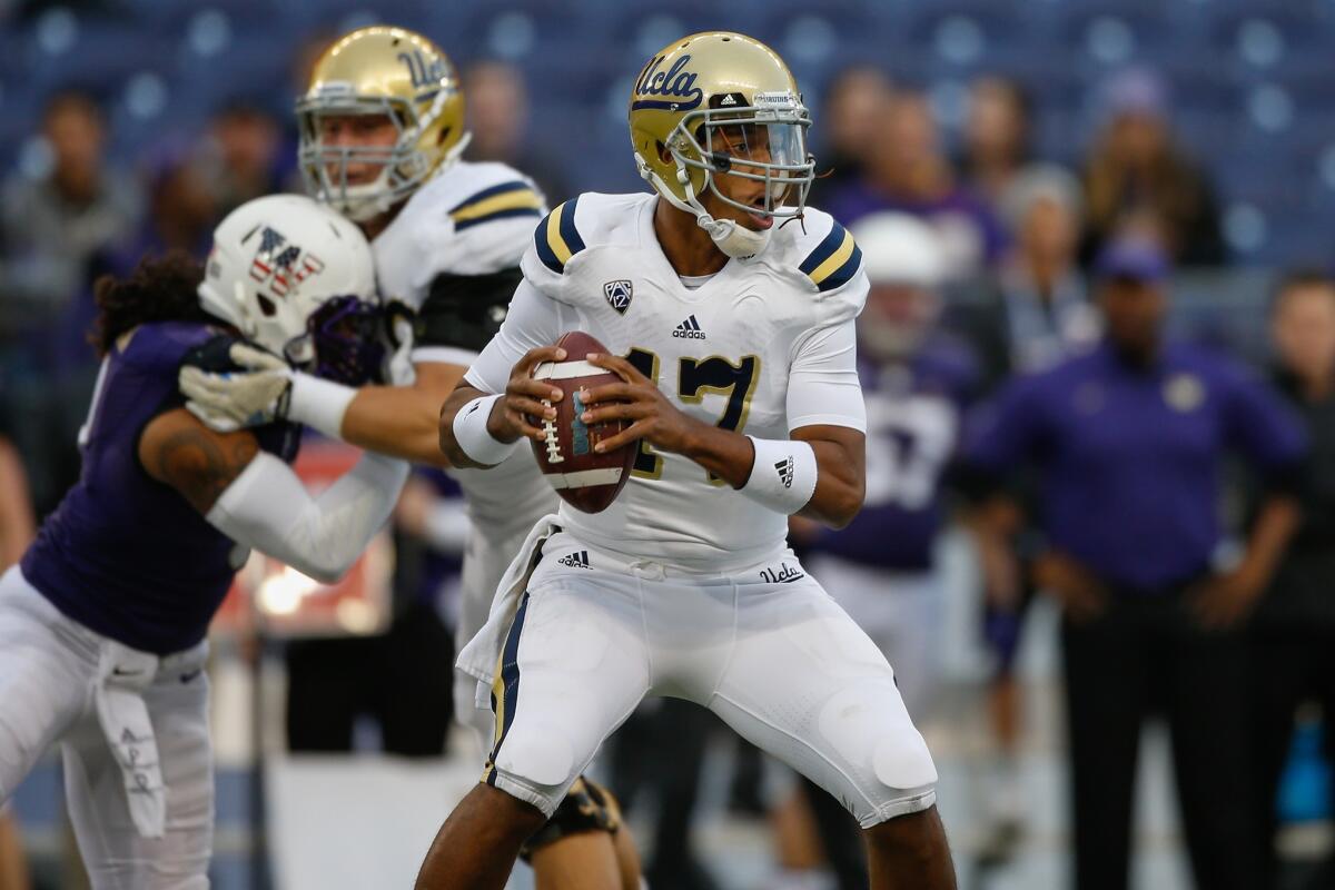 UCLA quarterback Brett Hundley looks downfield for a receiver in Saturday's game against Washington.