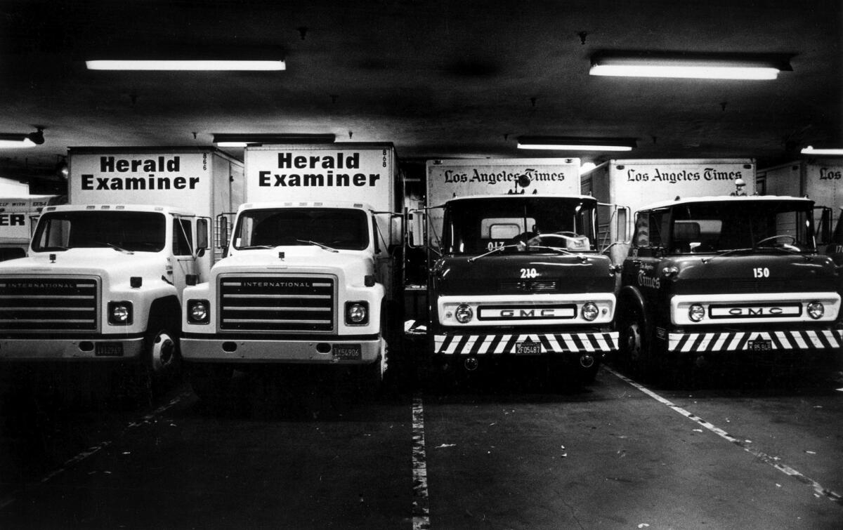 Oct. 11, 1983: Los Angeles Herald Examiner and Los Angeles Times delivery trucks share the Times Mirror Square concourse after a power outage shuts down the Herald Examiner presses.