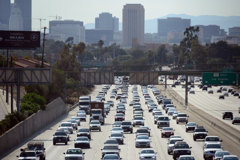 Motorists make their way out of downtown Los Angeles headed east on the Interstate 10 freeway on August 30, 2013 in California, where more Southern California residents are taking Labor Day weekend trips this year compared to in 2012, according to the Automobile Club of Southern California. Some 2.44 million residents have plans for a trip of at least 50 miles from home this Labour Day weekend, with about 1.93 million expected to drive, up 6.2 percent from 1.82 million last year, according to the Auto Club. AFP PHOTO/Frederic J. BROWN / AFP PHOTO / FREDERIC J. BROWN (Photo credit should read FREDERIC J. BROWN/AFP via Getty Images)