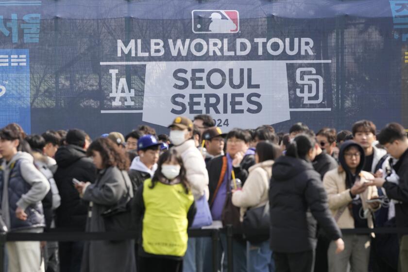 Fans gather prior to the 2024 Seoul Series game between Los Angeles Dodgers and San Diego Padres at Gocheok Sky Dom in Seoul, South Korea, Wednesday, March 20, 2024. (AP Photo/Ahn Young-joon)