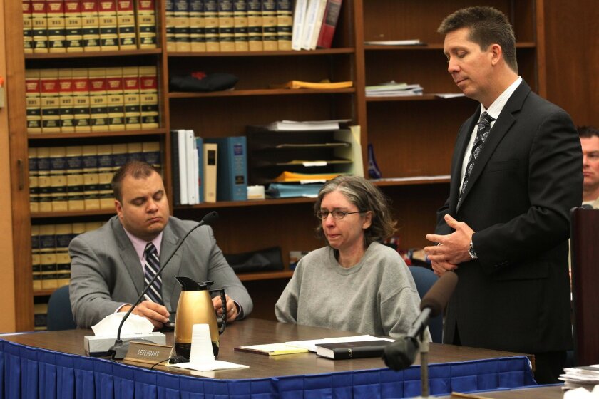 Jennifer Trayers, with her co-counsels Marc Kohnen, left, and Kerry Armstrong, right, during her sentencing. She was sentenced to 16 years to life for fatally stabbing her Navy doctor husband in their North Park home in December of 2010.