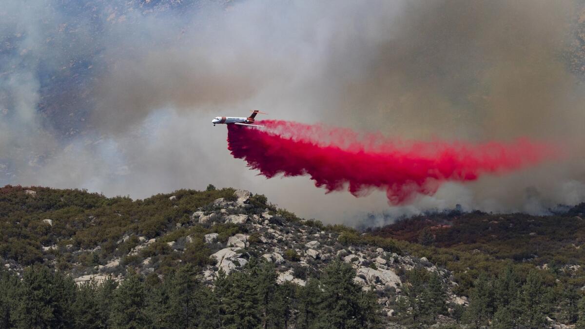 An air tanker drops fire retardant in the Lake Hemet area near where the Cranston fire burned in this July 27, 2018 photo.