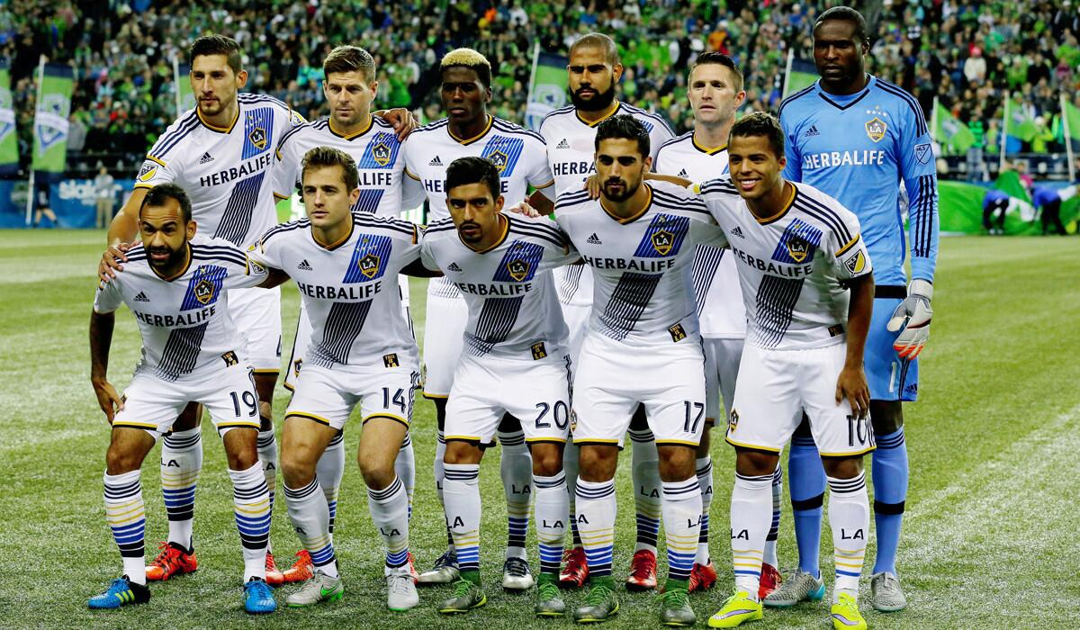Los Angeles Galaxy players pose for the traditional pre-match team portrait before an MLS soccer western conference knockout round playoff match against the Seattle Sounders, on Oct. 28.