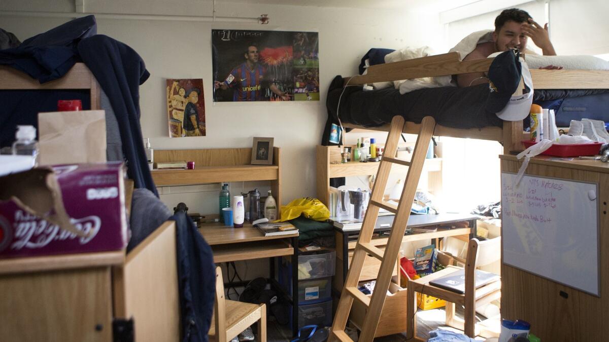 First-year UC Santa Cruz student Luis Torres says he has hit his head numerous times on the low ceiling of the lounge he shared with five others.