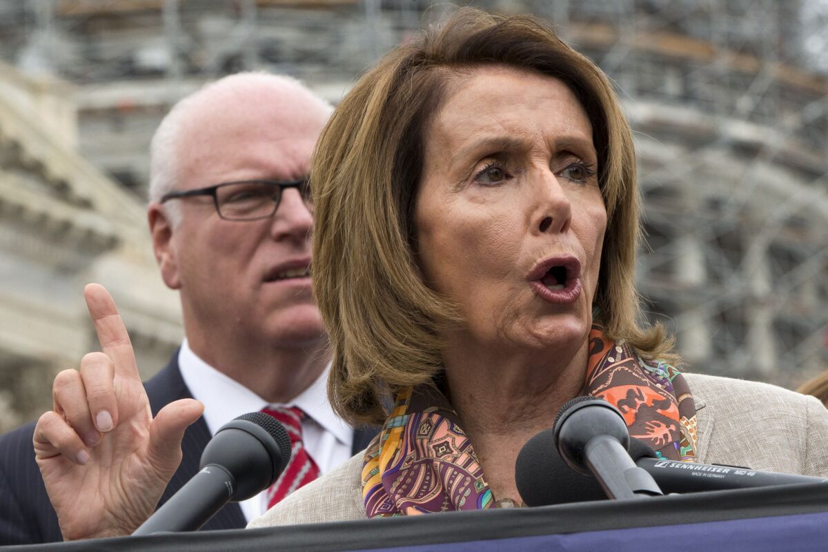 Rep. Joseph Crowley (D-N.Y.) listens as House Minority Leader Nancy Pelosi (D-San Francisco) speaks during a news conference on Capitol Hill in Washington on Oct. 7 to discuss the looming increase in Medicare Part B premiums for some seniors.
