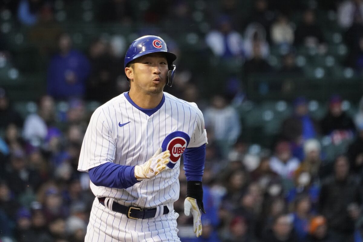 Chicago Cubs' Seiya Suzuki heads to first during the second inning of a baseball game against the Tampa Bay Rays Monday, April 18, 2022, in Chicago. (AP Photo/Charles Rex Arbogast)