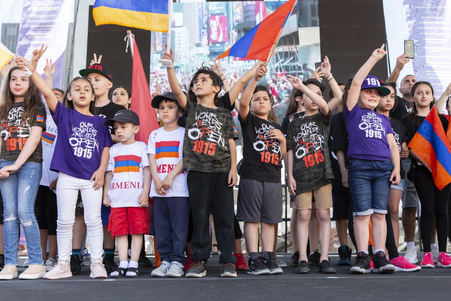 Children participate in a rally outside the Turkish Consulate in Los Angeles to remember the Armenian genocide of more than a century ago.
