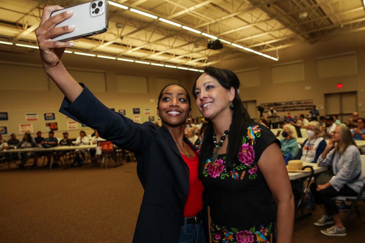 Malia Cohen, left, takes a selfie with Leticia Perez at a campaign event in Bakersfield in October.