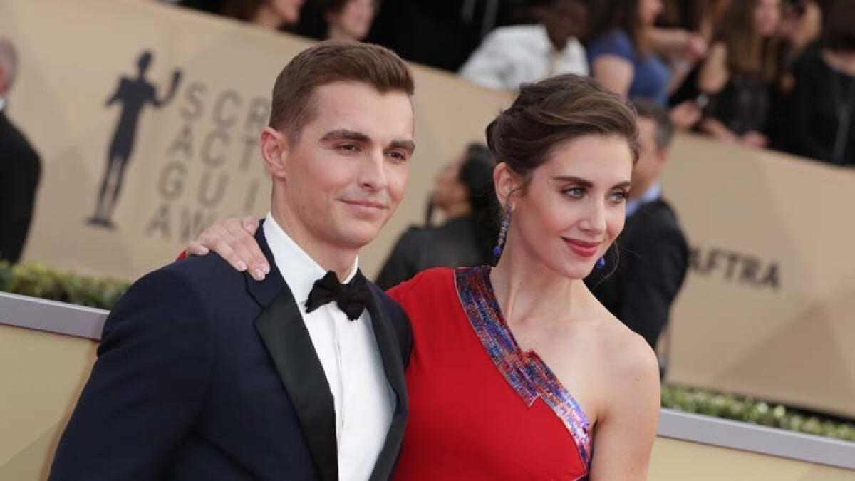 Husband and wife Dave Franco and Alison Brie arrive at the 24th SAG Awards.