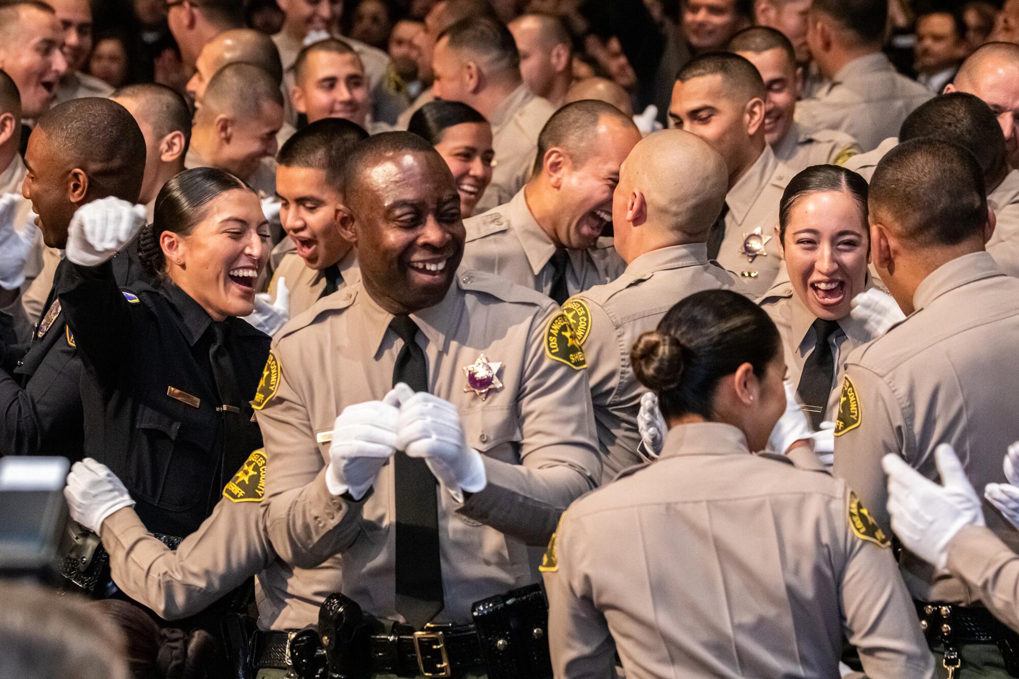 Los Angeles County Sheriff Academy Class 464 celebrate successfully graduating at a ceremony held at East 