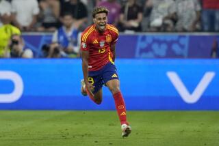 Spain's Lamine Yamal celebrates after scoring his side's first goal during a semifinal match between Spain and France