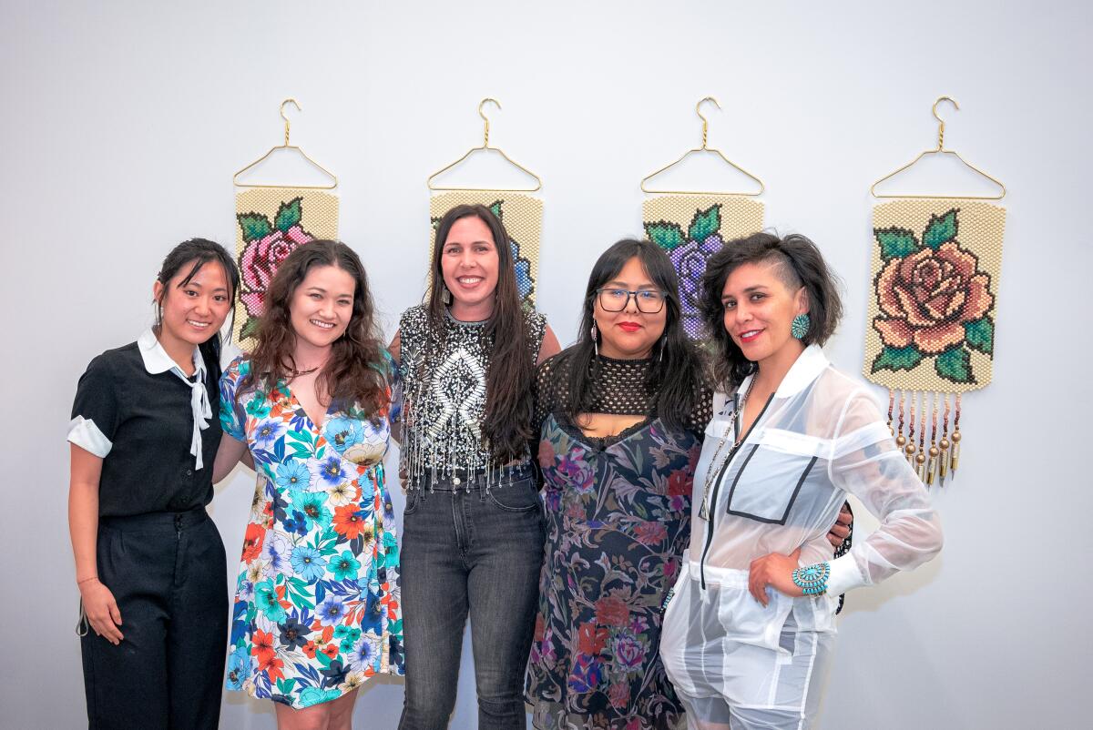 A group photo from The Chapter House's recent summer art exhibit, "Diary of a native femm(nist)."