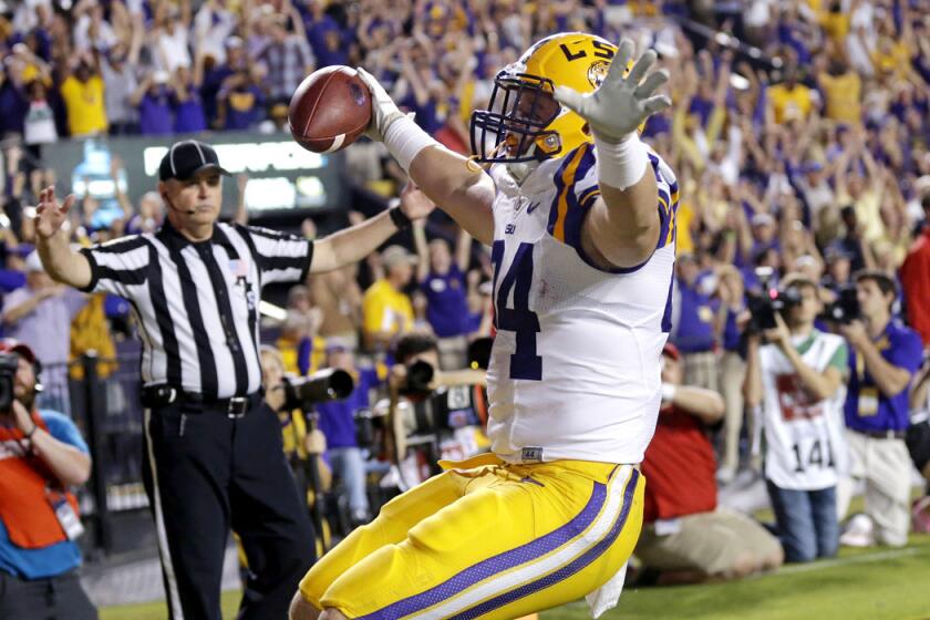 LSU tight end Logan Stokes celebrates his touchdown reception in the second half that gave the Tigers their winning margin in a 10-7 victory over No. 3-ranked Mississippi.