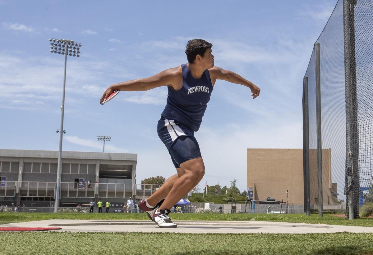 Newport Harbor's Aidan Elbettar throws during the boys' discus at the CIF Southern Section Masters Meet at El Camino College.