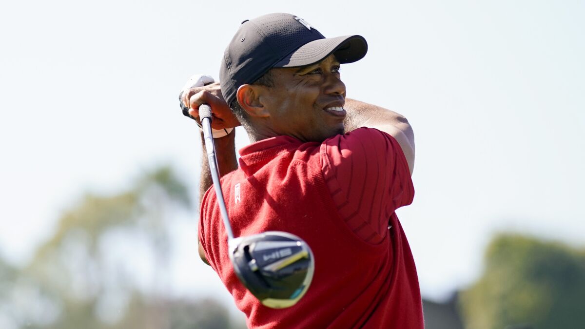 Tiger Woods tees off on the 18th hole during the final round of the Genesis Invitational golf tournament at Riviera Country Club on Feb. 16 in the Pacific Palisades.
