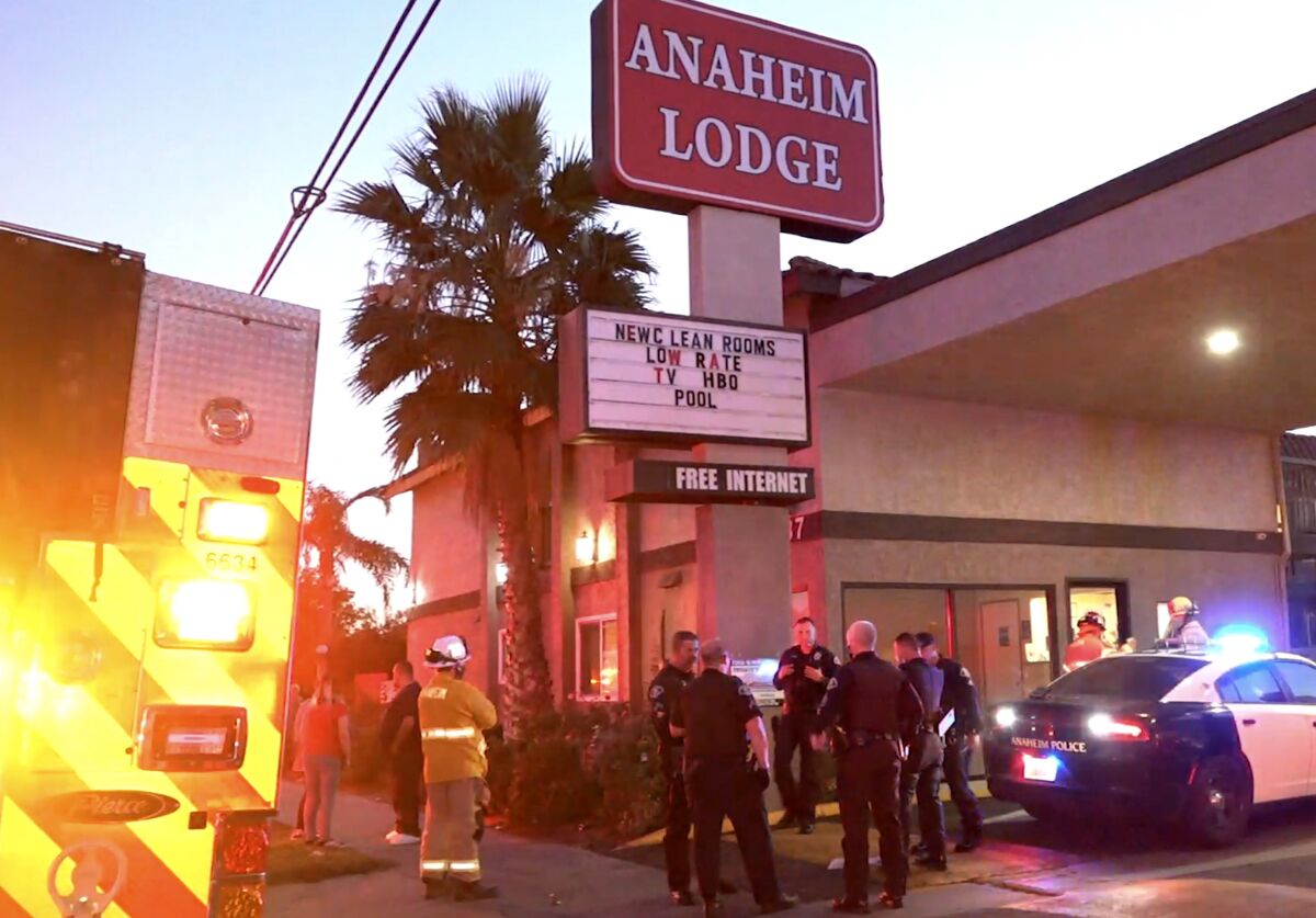 An investigation is underway after a man backed an SUV into the Anaheim Lodge motel, injuring three people. 