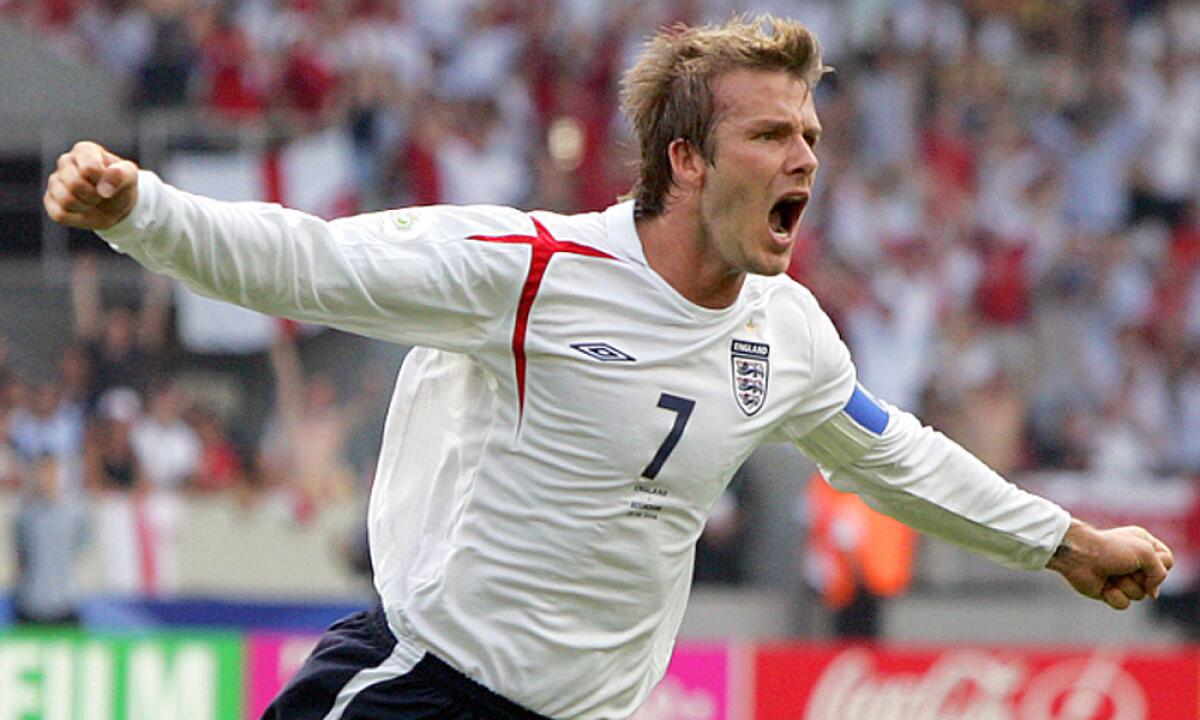 England's David Beckham celebrates after scoring the opening goal during a round of 16 World Cup match against Ecuador on June 25, 2006.