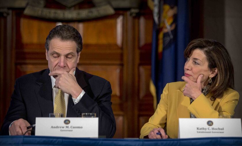 FILE - This photo from Wednesday, Feb. 25, 2015, shows New York Gov. Andrew Cuomo, left, and Lt. Gov. Kathy Hochul during a cabinet meeting at the Capitol in Albany, N.Y. Leaders in the state Assembly announced an impeachment investigation against Cuomo over allegations of sexual harassment, if successful, Hochul would would take over as governor. (AP Photo/Mike Groll, File)