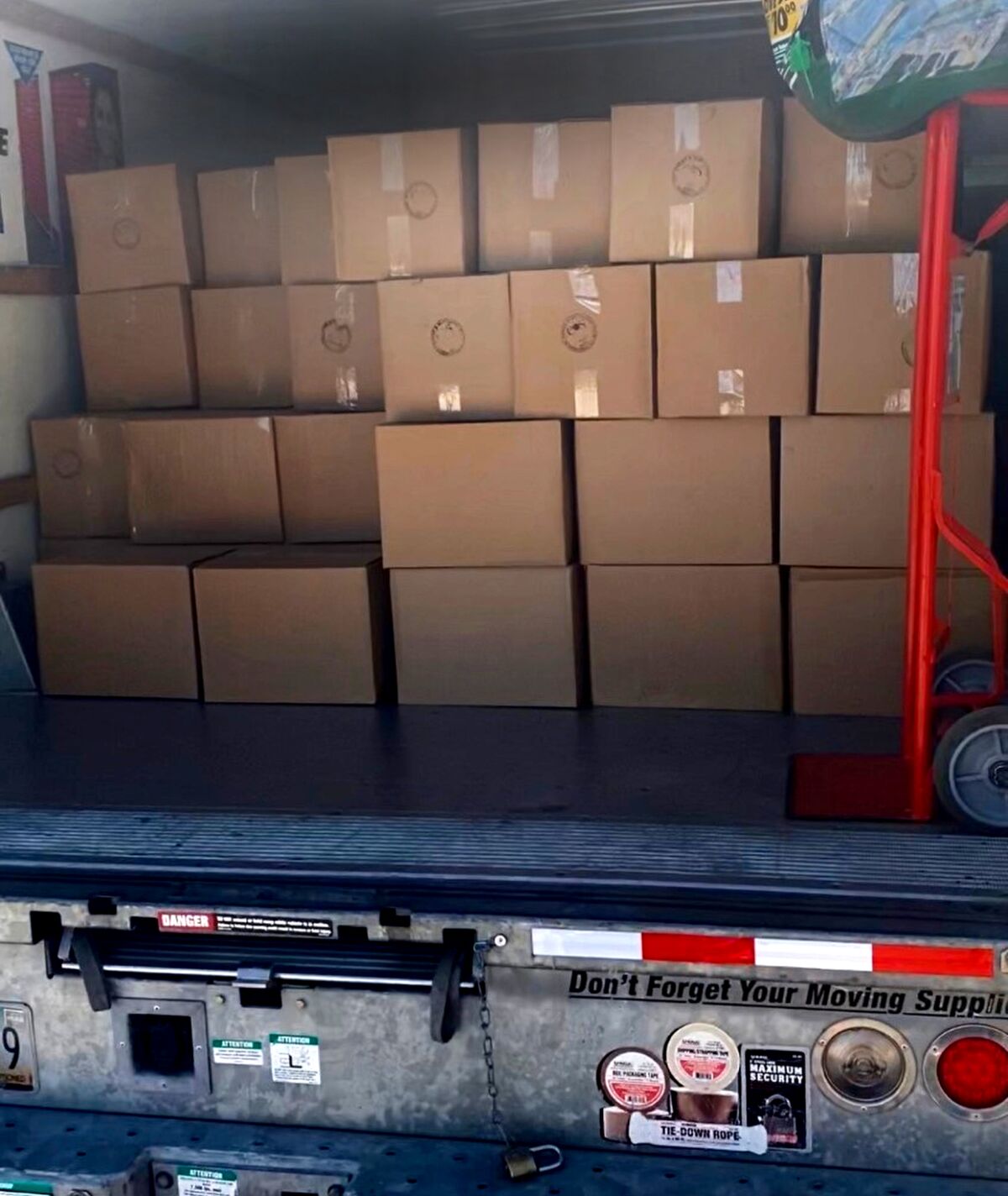 Boxes of surgical masks fill the back of a U-Haul in Austin. The masks, manufactured at a factory in Mexico, were driven over the border and distributed to Texas medical offices. 