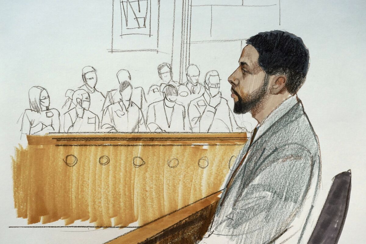 In this courtroom sketch, actor Jussie Smollett takes the stand in his own defense Monday, Dec. 6, 2021, at the Leighton Criminal Courthouse on day five of his trial in Chicago. (AP Photo/Cheryl Cook)