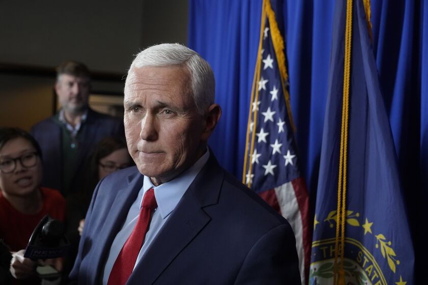 Former Vice President Mike Pence faces reporters after making remarks at a GOP fundraising dinner, Thursday, March 16, 2023, in Keene, N.H. (AP Photo/Steven Senne)