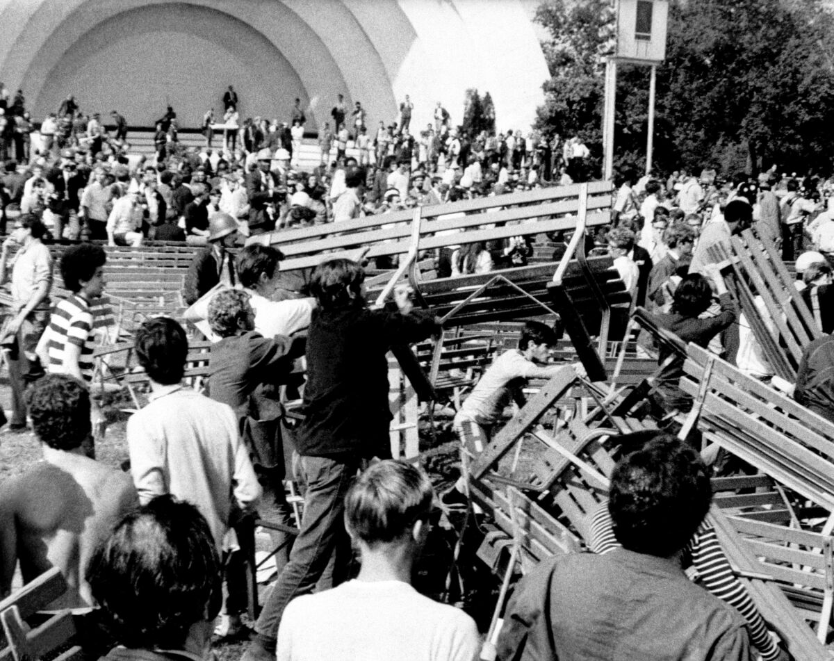 Demonstrators used park benches to construct a barricade against Chicago police during the 1968 Democratic convention.