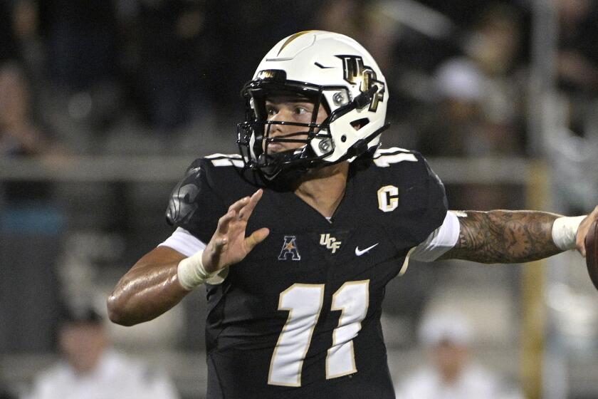 Central Florida quarterback Dillon Gabriel (11) sets up to throw a pass during the first half.