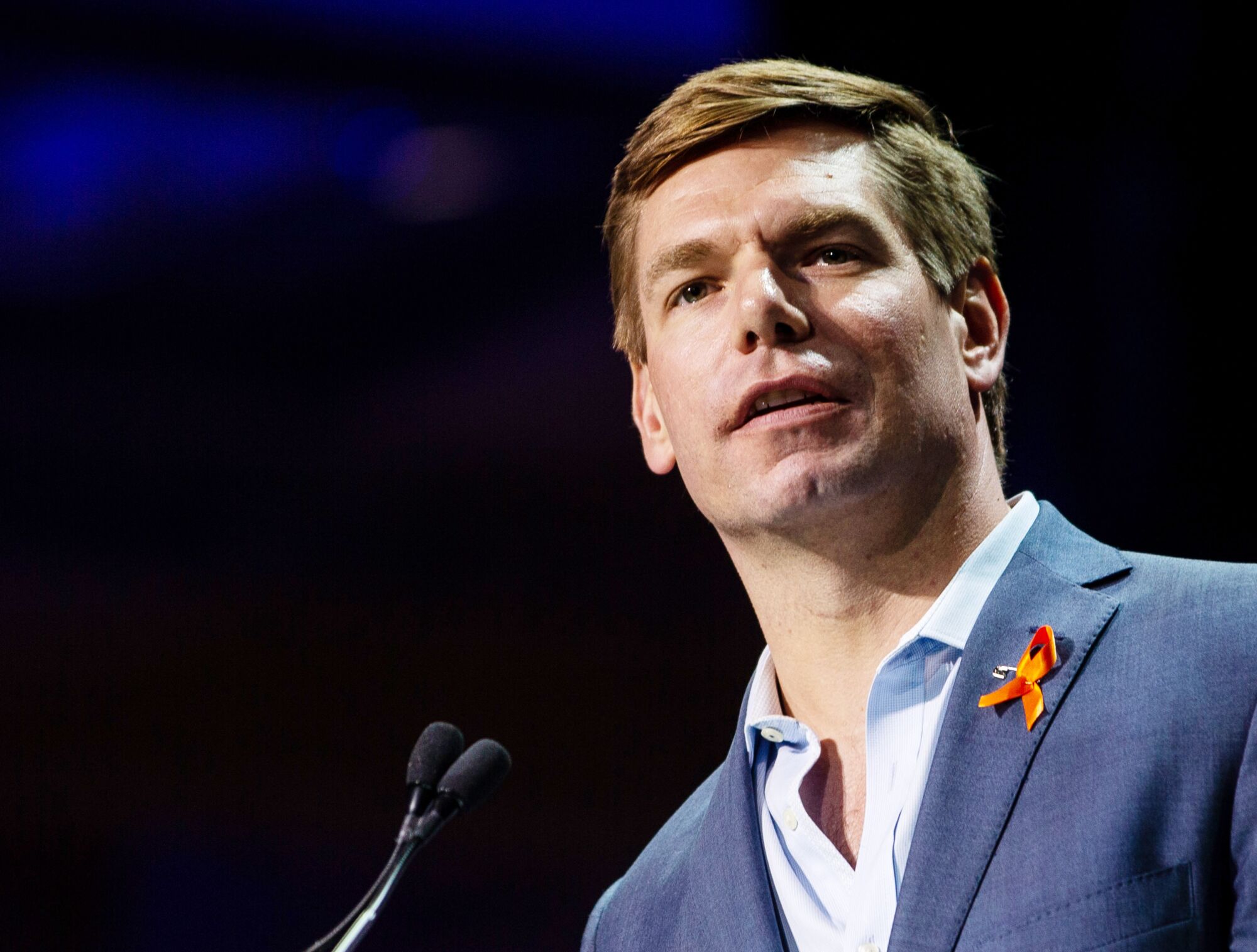 Rep Eric Swalwell speaks at a convention.
