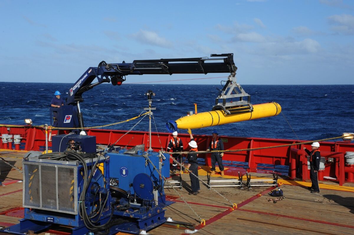 The Bluefin-21 underwater vehicle is hoisted back aboard the Australian ship Ocean Shield after successful buoyancy testing in the Indian Ocean.