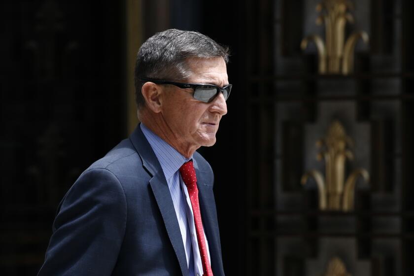 FILE - In this Monday, June 24, 2019, file photo, Michael Flynn, President Donald Trump's former national security adviser, departs a federal courthouse after a hearing, in Washington. Trump said Sunday, March 15, 2020, that he is considering a full pardon for Flynn, who had pleaded guilty to lying to the FBI about dealings with Russia’s ambassador before Trump took office. (AP Photo/Patrick Semansky, File)