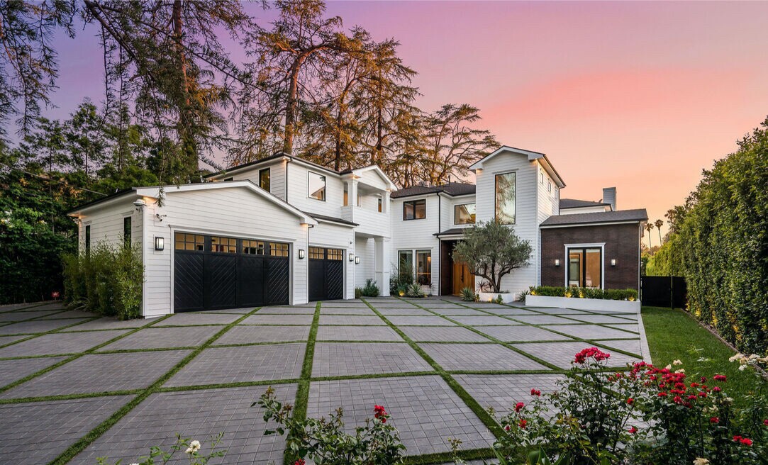 The nearly half-acre property comes with a modern farmhouse, a two-bedroom guesthouse and a pool with a basketball hoop.