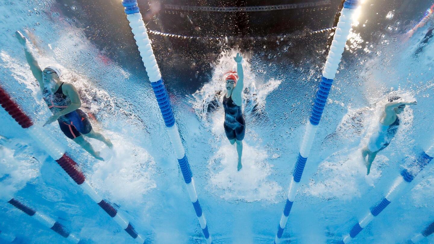 Allison Schmitt, Katie Ledecky and Leah Smith compete in a final heat for the Women's 200 Meter Freestyle.